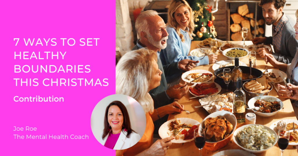 A family sit around the table for Christmas dinner. Boundaries are important to maintain mental health over the Christmas period.